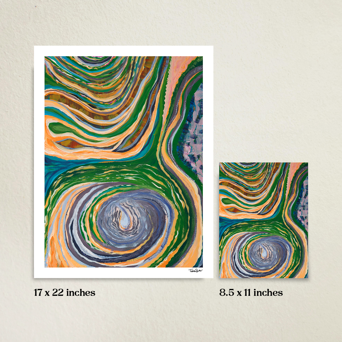 The Never-Ending Spiral 17 x 22 inch fine art print with 8.5 x 11 inch fine art print. A beige wall is in the background. Sizes are labeled under each print. Prints are next to each other to compare the size difference.