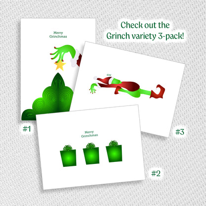Three Grinch-themed greeting cards on a textured surface with promotional text.