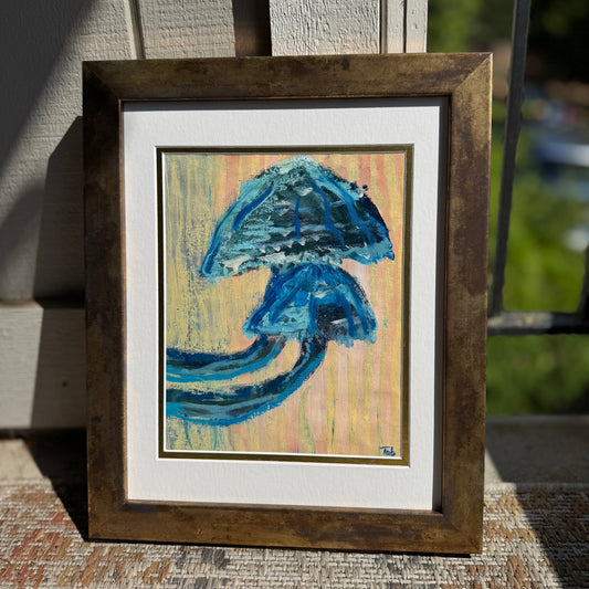 Framed abstract mushroom artwork with blue and beige colors on a textured surface.