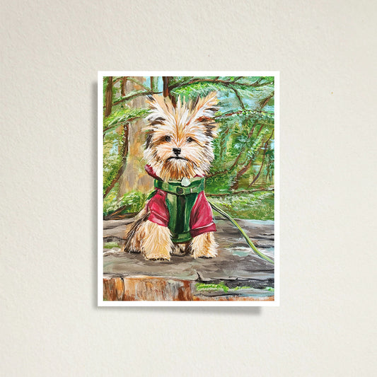 Print of a painting of a dog in a red sweater and green collar on top of a tree stump in the woods.