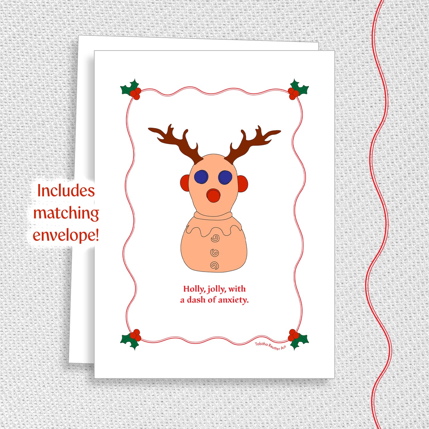 Cute holiday greeting card with a matching white envelope on a textured gray background. A graphic red wiggle line is on the right side of the image, matching the texture on the card.