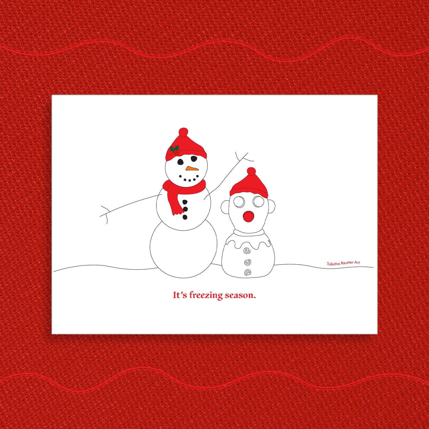 White Christmas greeting card displayed on a vibrant Holiday red textured background. On the greeting card, a simple line drawing illustration of a snowman next to a snow-person version of the neurospicy squeeze toy, Panic Pete, on a snowy hill. Red text, under the artwork, reads: “It’s freezing season.”