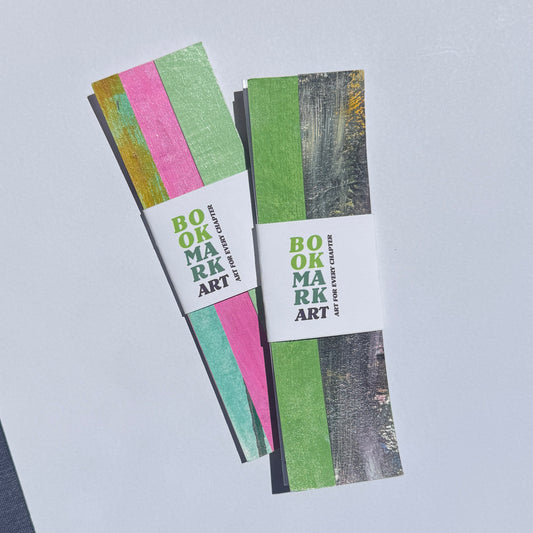 Two striped bookmarks with a white label on a light gray background