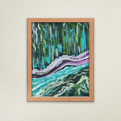By the Water abstract fine art print in a wooden frame. Hanging on a beige wall. Streaks of green and blue collide vertically against one another in a vibrant display of hues. 