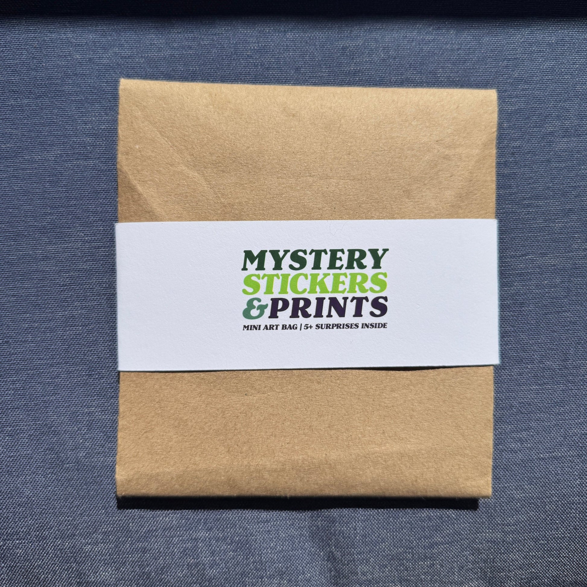 Kraft paper box with a white label on a blue textured surface