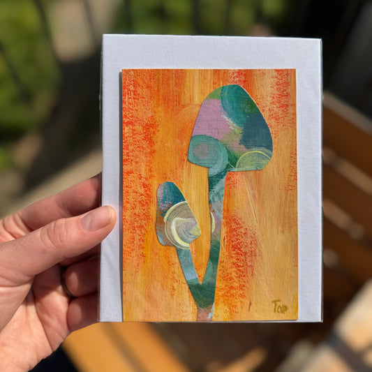 Abstract pink and blue mushroom collage on a vibrant orange background.
